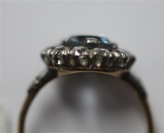 A mid 20th century aquamarine and diamond oval cluster ring, by Tiffany & Co, size M.